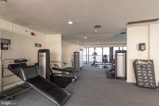 gym featuring a textured ceiling