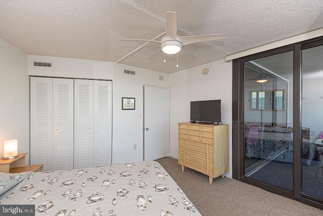 bedroom with access to outside, carpet flooring, ceiling fan, a textured ceiling, and a closet