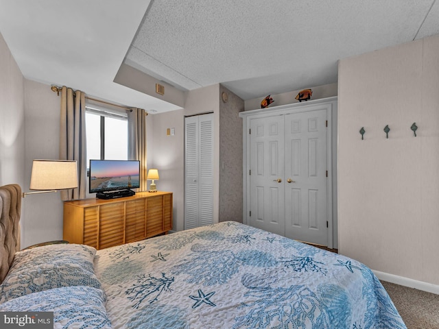 10900 Coastal Hwy Unit 915, Ocean City, MD 21842 - bedroom with carpet floors, baseboards, and two closets