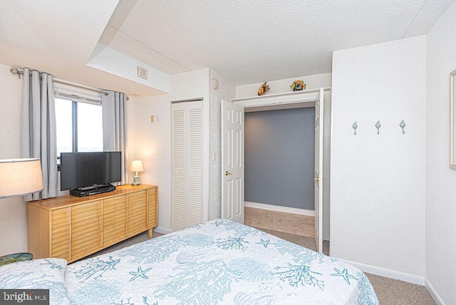 bedroom featuring a closet and carpet floors