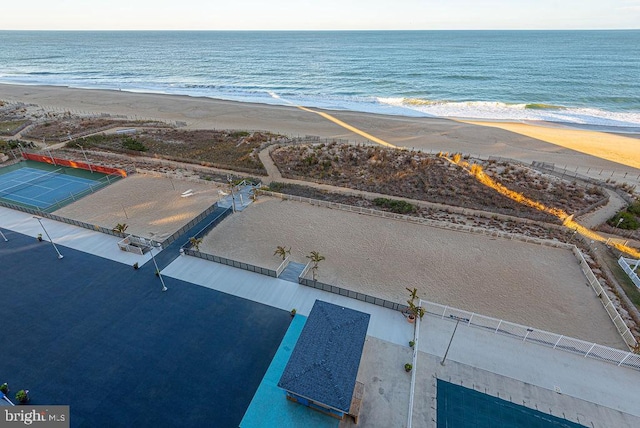 birds eye view of property featuring a water view and a view of the beach