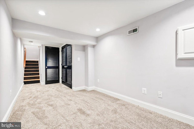 unfurnished bedroom with a spacious closet and light colored carpet