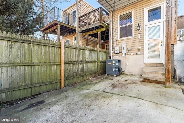 view of patio / terrace featuring central air condition unit and a wooden deck