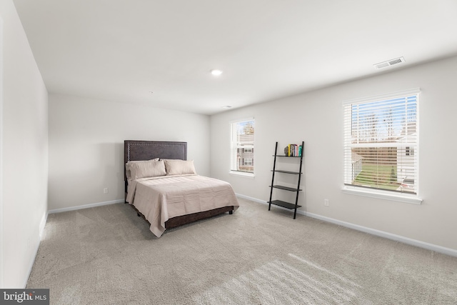 bedroom with light carpet