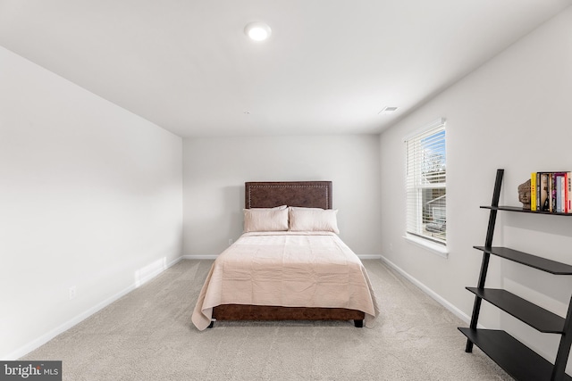 bedroom featuring light colored carpet