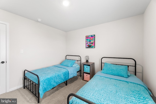 bedroom with light colored carpet