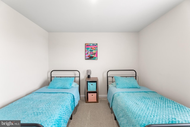 bedroom with light colored carpet