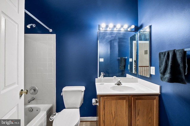 full bathroom featuring vanity, toilet, and tiled shower / bath