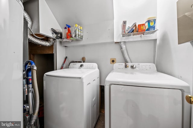 washroom with washing machine and clothes dryer