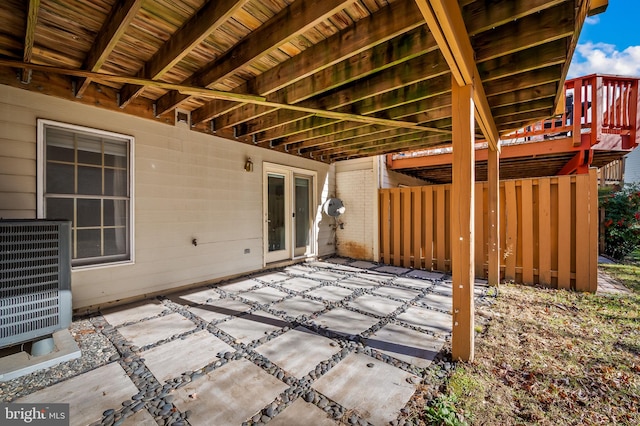 view of patio / terrace with central AC and a wooden deck