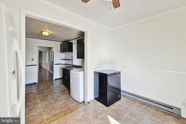 kitchen featuring refrigerator, baseboard heating, white fridge with ice dispenser, ceiling fan, and washer / clothes dryer