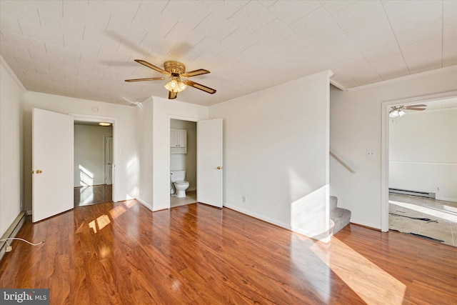 spare room featuring hardwood / wood-style floors and ceiling fan