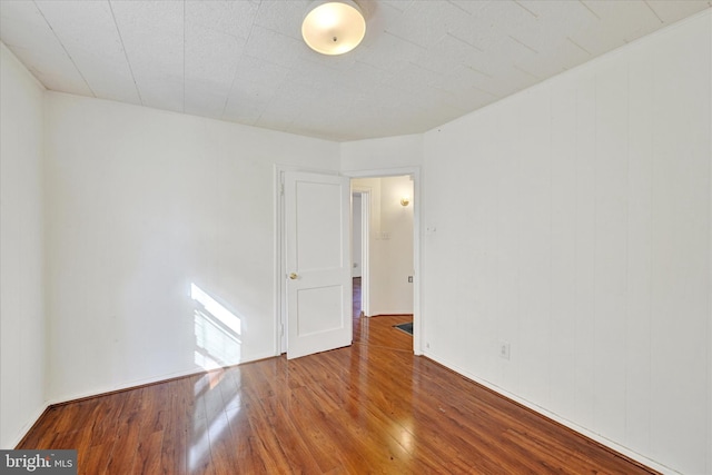 spare room featuring hardwood / wood-style floors