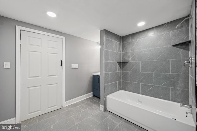 bathroom with vanity and tiled shower / bath combo