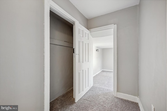 hallway with carpet