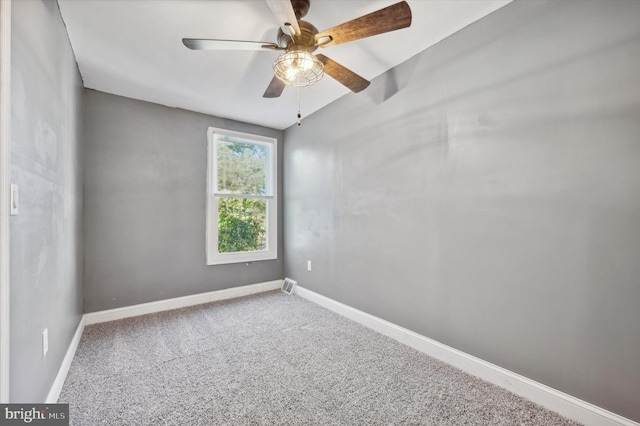 unfurnished room featuring carpet, vaulted ceiling, and ceiling fan