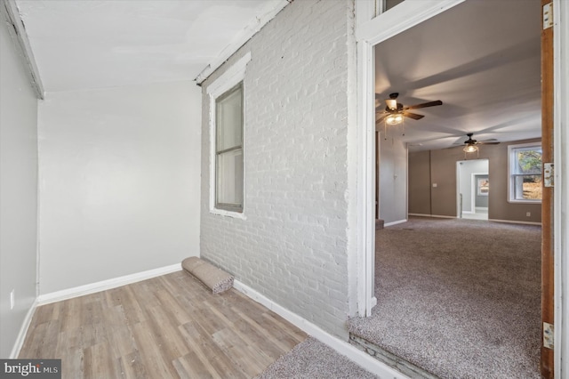 spare room with light hardwood / wood-style floors and ceiling fan