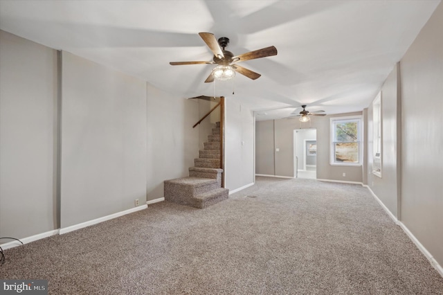 unfurnished living room with carpet floors and ceiling fan