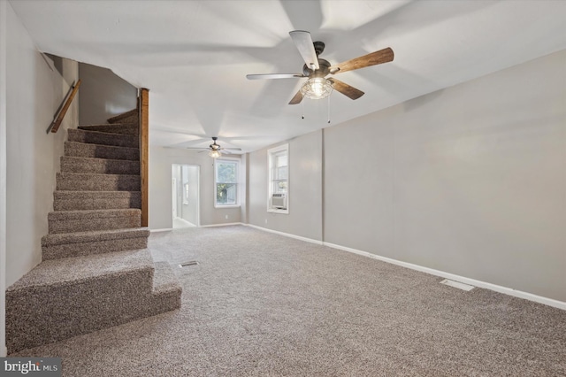 interior space featuring carpet flooring and ceiling fan