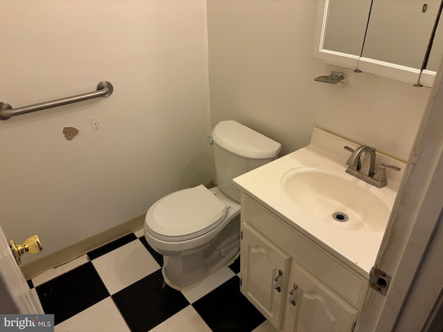 bathroom with toilet and vanity