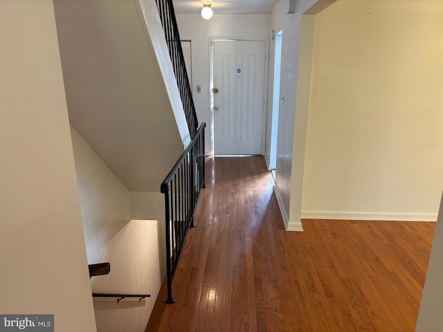 corridor with dark hardwood / wood-style floors