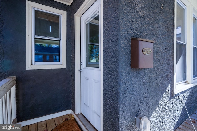 view of exterior entry with radiator heating unit