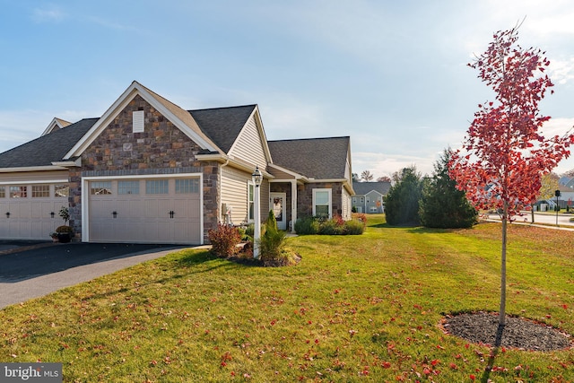 view of front of house featuring a front yard and a garage