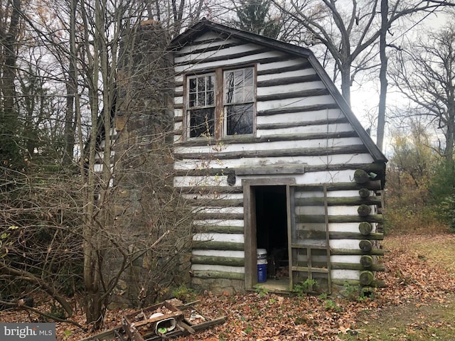 view of home's exterior featuring an outdoor structure