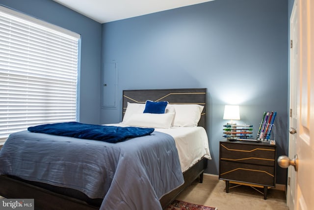 bedroom featuring light carpet