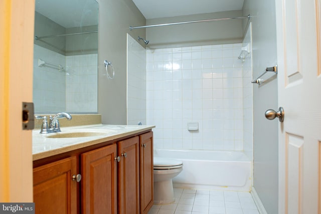 full bathroom with tile patterned flooring, vanity, toilet, and tiled shower / bath