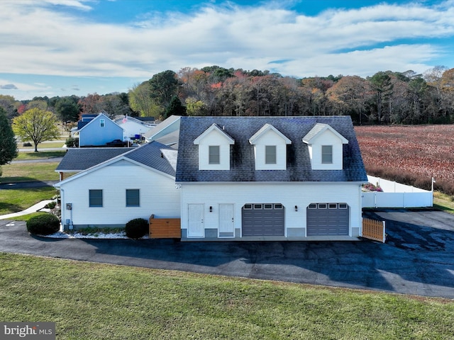 view of front facade with a front lawn and a garage