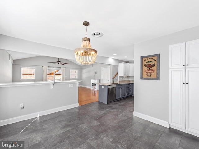 kitchen with gray cabinetry, white cabinetry, stainless steel dishwasher, decorative light fixtures, and a breakfast bar