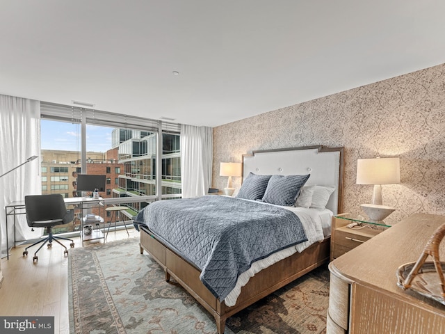 bedroom with light hardwood / wood-style floors