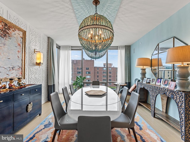 dining room featuring an inviting chandelier and floor to ceiling windows