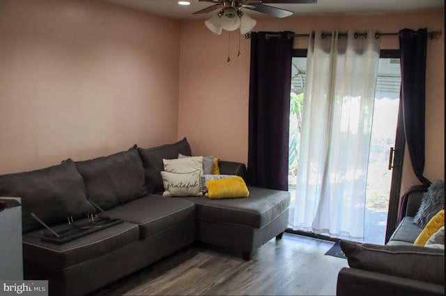 living room with hardwood / wood-style floors and ceiling fan