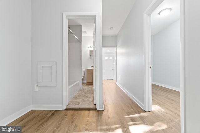 bathroom featuring hardwood / wood-style flooring and a bathing tub