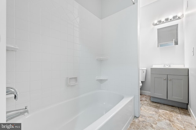 full bathroom with vanity, toilet, and tiled shower / bath combo