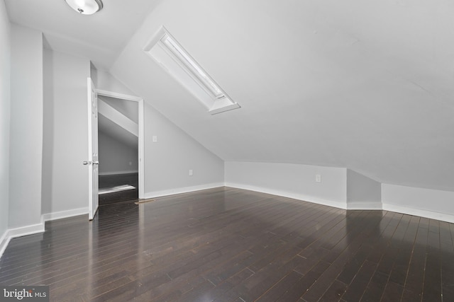 1826 Brunswick Ave, Lawrence Township, NJ 08648 - bonus room with lofted ceiling, dark wood-style floors, and baseboards