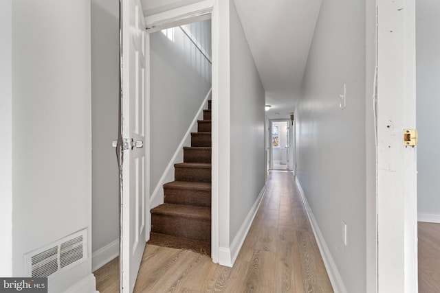 corridor featuring light hardwood / wood-style floors