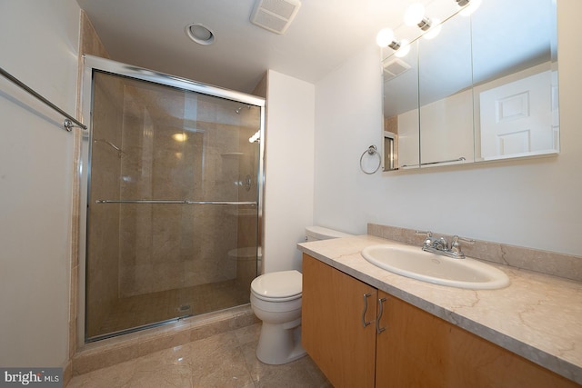 bathroom featuring vanity, toilet, and walk in shower