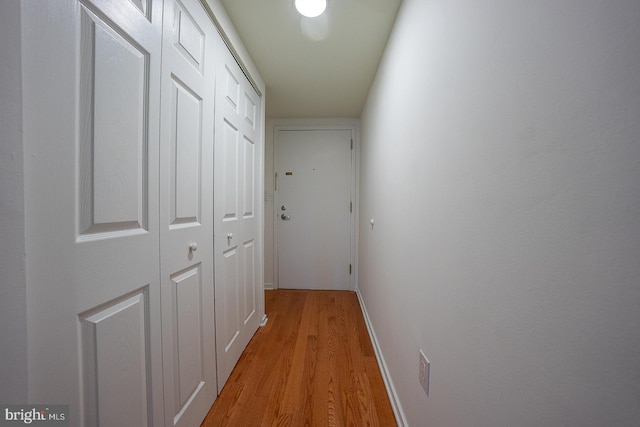 hall with light hardwood / wood-style floors