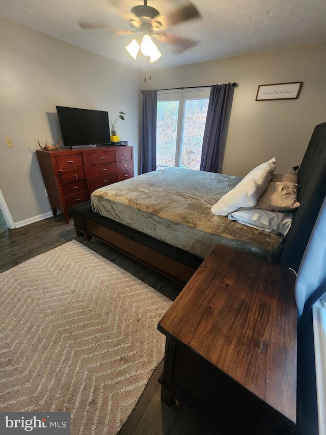 bedroom featuring hardwood / wood-style floors and ceiling fan