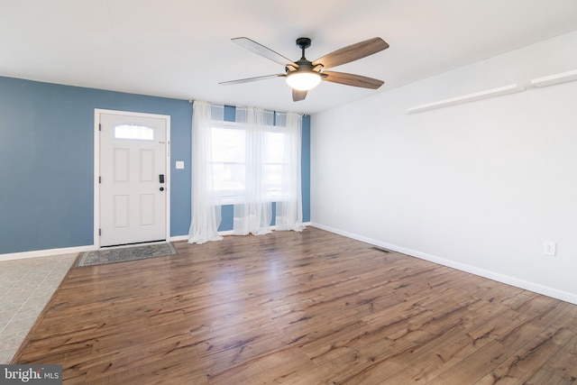 foyer with wood-type flooring and ceiling fan