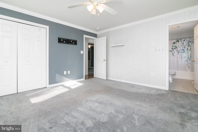 unfurnished bedroom with light carpet, ensuite bath, ceiling fan, ornamental molding, and a closet