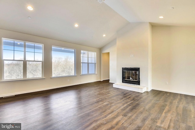 unfurnished living room with dark hardwood / wood-style flooring and lofted ceiling