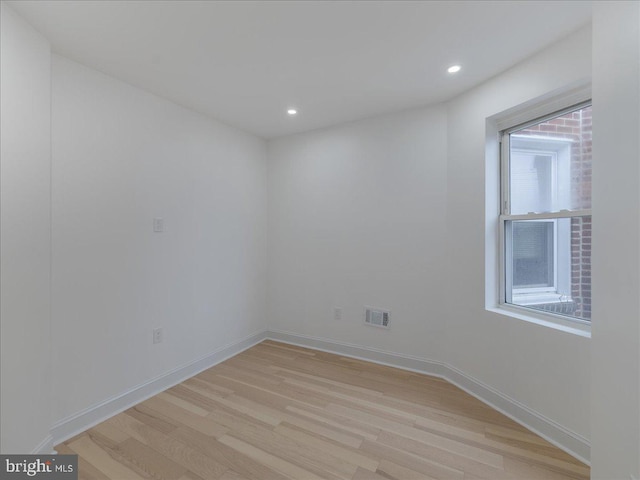 spare room with light wood-type flooring