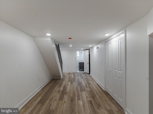 corridor with wood-type flooring