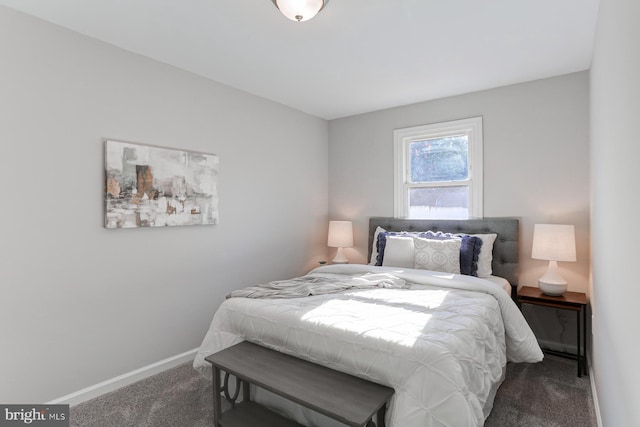 bedroom featuring dark carpet