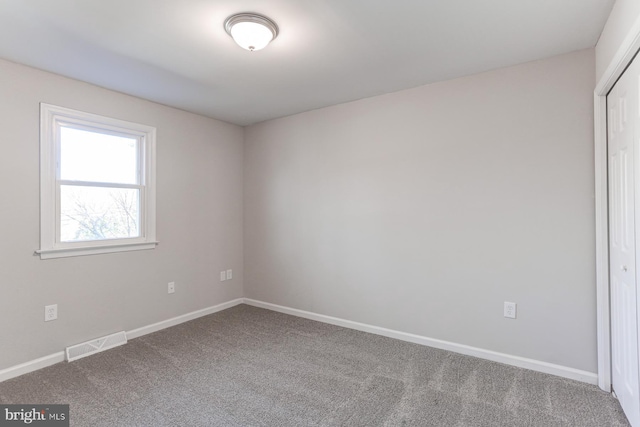 view of carpeted spare room