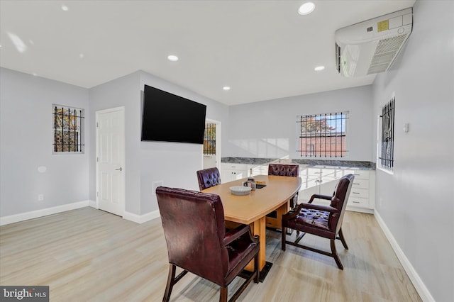 dining area with light hardwood / wood-style flooring